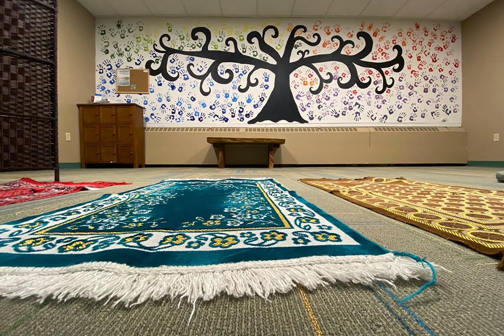 Interior shot of the Interfaith Prayer and Reflection Room featuring rugs